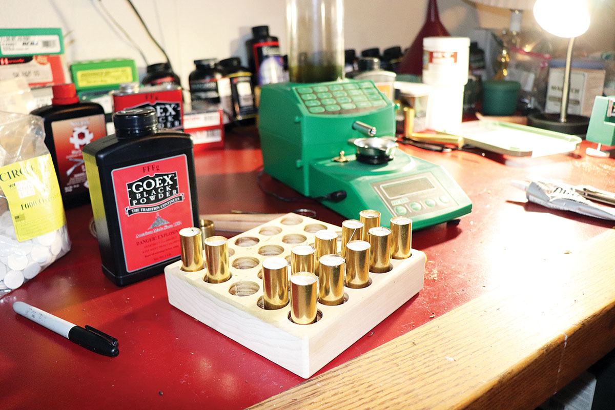 Brass shotshells sitting in the loading block waiting for the E6000 glue to dry.